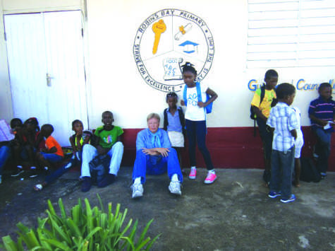 Mr. Teslow is joined by students from Robins Bay Primary School, Ecology Camp prior to a drawing activity at Castleton Gardens during his trip to Jamaica last summer.