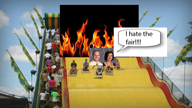 Unedited photo of Anna Reid and her husband Shawn Reid going down the slide, leaving a trail of chaos behind them.
