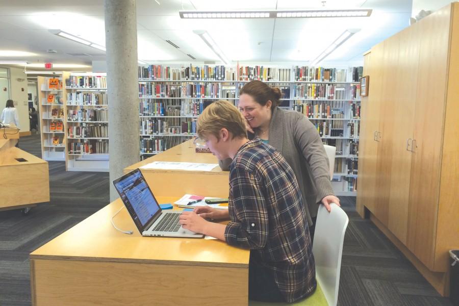 Kali Olson and Lizz Buchanan send out emails on behalf of the library, yearbook, and tech staff. 