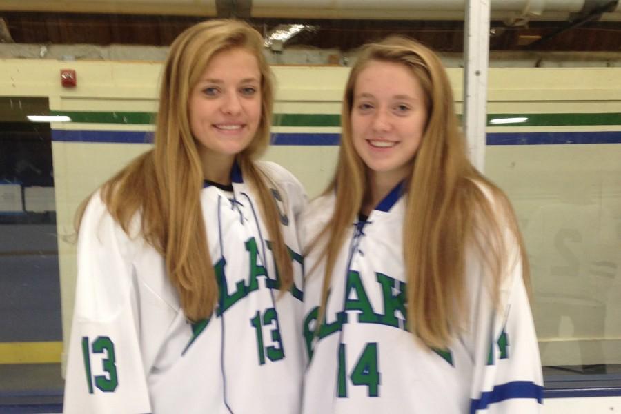 CC and Sylvie Wallin show off their hockey jerseys