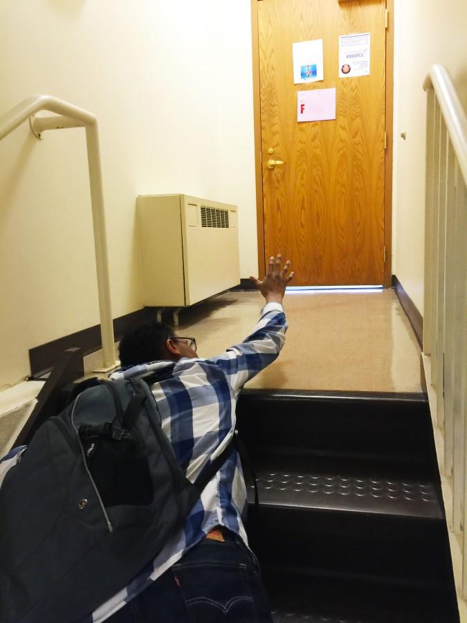 Josh Wilson 18 struggles to finish the climb from the math wing to the third floor.