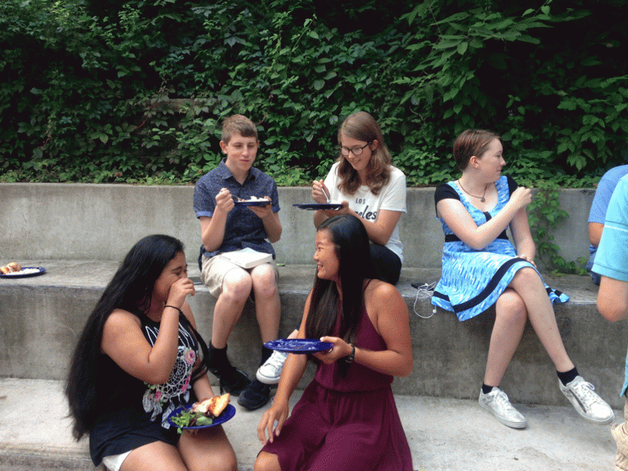 Sophomores soak up the sun while they can in the school courtyard during lunch. 