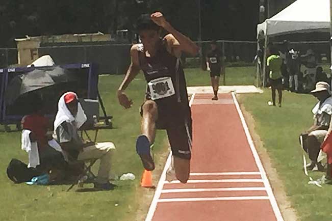 Shiv Jhanjee 18 competing in triple jump at Track Nationals in Houston. 