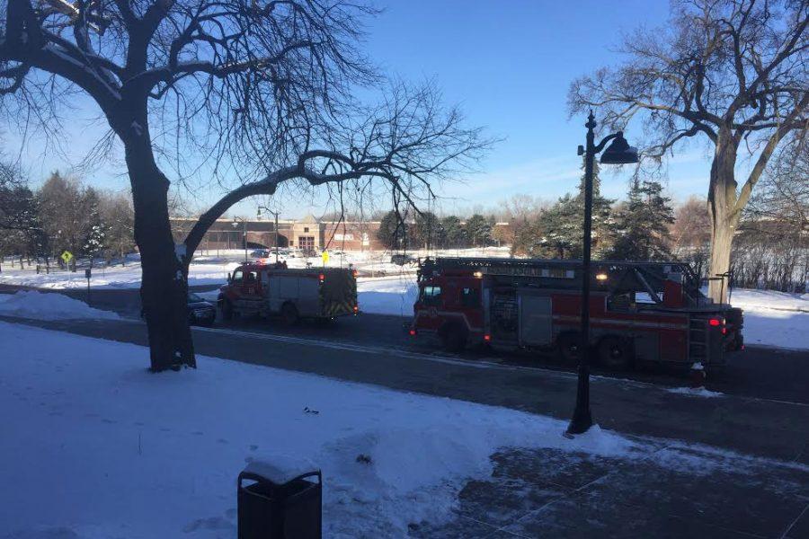 Fire trucks lined up outside the main entrance to the building after students and faculty funneled back into the building. 