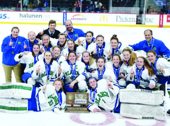 Girls Hockey along with Coach Shawn Reid and assistant coaches Alex Ward, Cody Bishop, Maryanne Menafee, and Ashley Stenerson with their championship plaque state on February 25. 