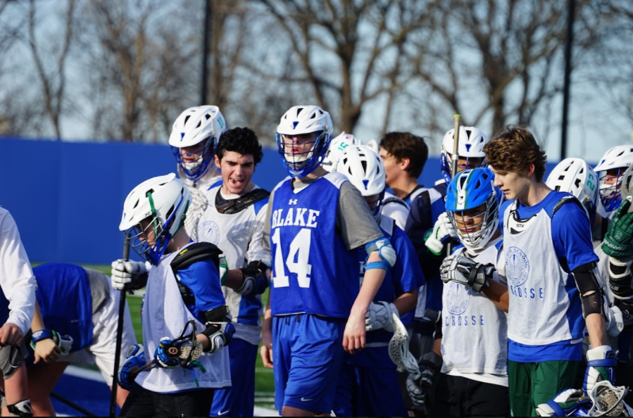 The boys' lacrosse team hooting and hollering after a successful captains practice in 2017.
