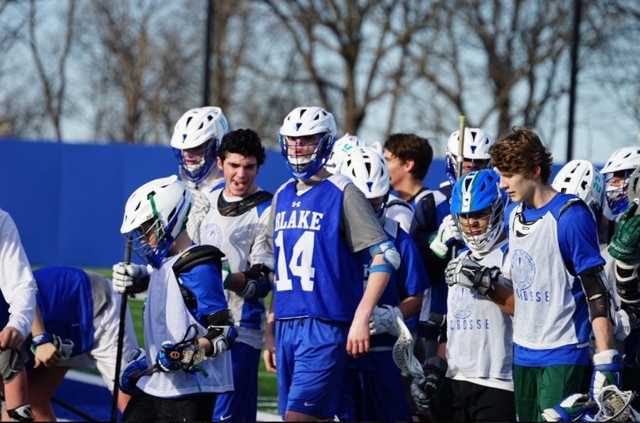 The boys lacrosse team hooting and hollering after a successful captains practice in 2017.