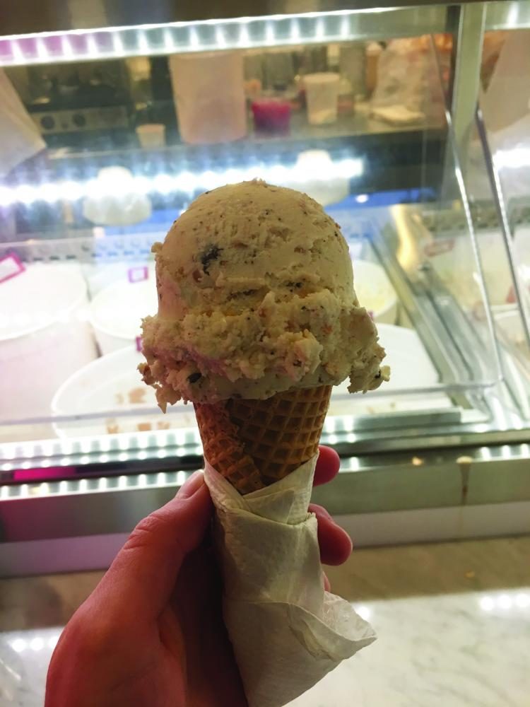 A scoop of Charlottes web, a creamy flavor swirled with toasted coconut and chocolate chips. 