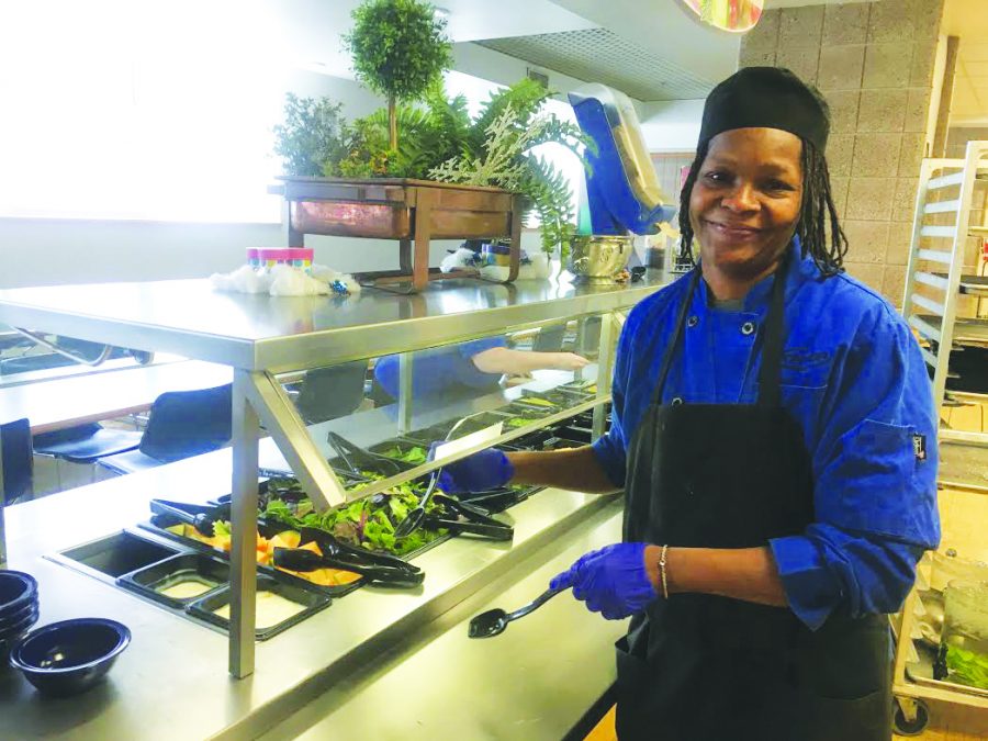 Newcomb preps the salad bar with a wide variety of fresh options: greens, fruits, and a different salad mix everyday. Whats your favorite salad by Shelia?