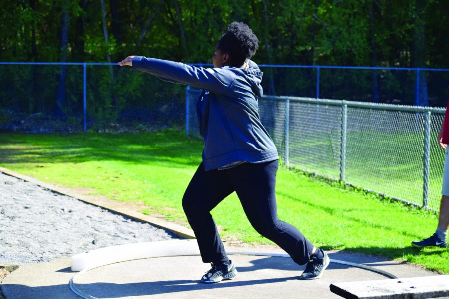 Cheryl Minde ‘20 throws a discus during a practice. The team practices all of their various events along the fields and track at the Hopkins campus.