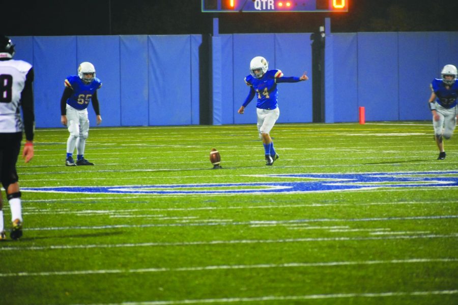 Place kicker Theo Crosby kicks off in a game against St. Paul Central on October 5.