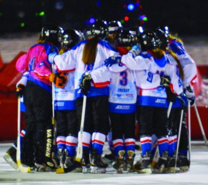 Lucy Kiernat and her team huddle up before a game. 