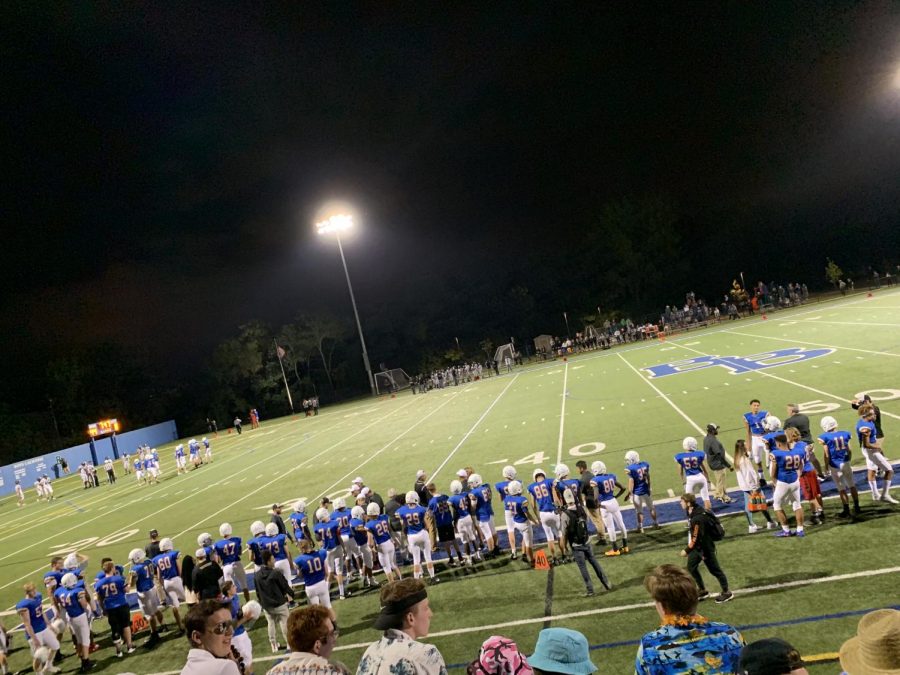 The Wolfpack gathers on the sidelines of Blakes home field. 