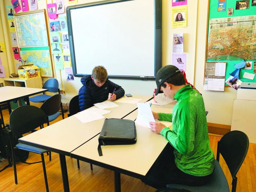 Andrew Richardson ‘23 and David Carlson ‘23 concentrate on an assignment during TASC. Distance is another tactic employed by teachers to protect academic honesty between students. 