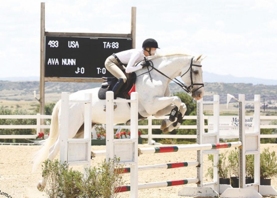 Grace+Griffin+%E2%80%9821+participates+in+a+Hunter%2FJumper+Horse+Show+in+Parker%2C+Colorado.