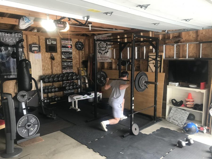 Lachen Reid 20 works out in his home gym.