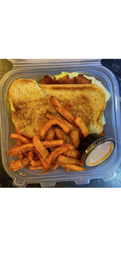 The Lowrys BLT-A with a side of sweet potato fries.