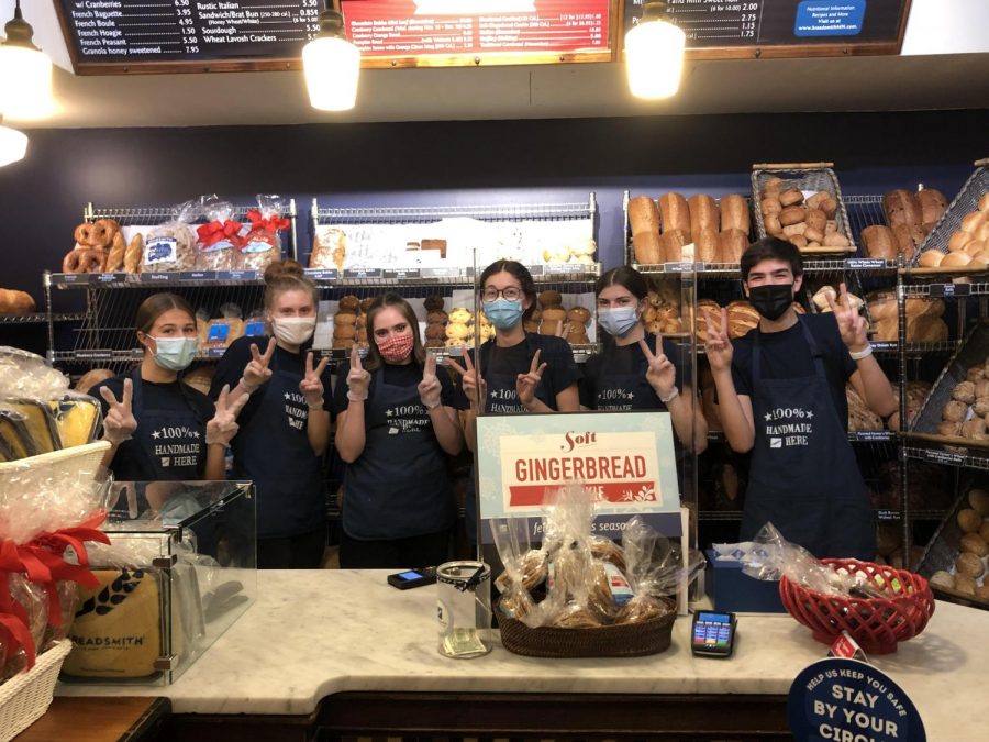 Haya Fine ’22 with two of her co-workers.  All employees wear masks at all times, and employees are only allowed in a few at a time.