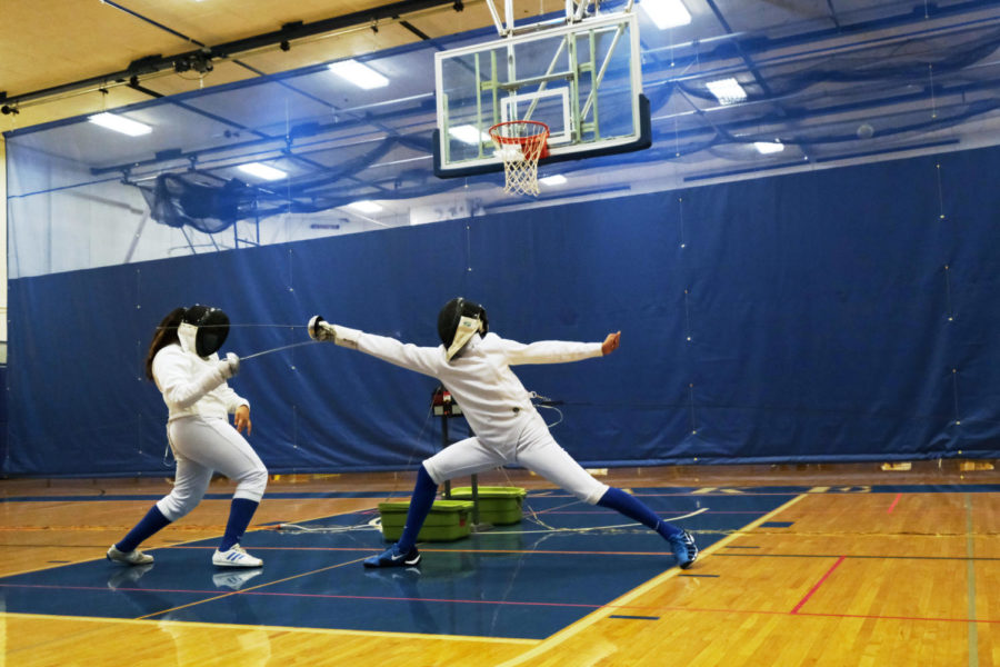 Frida Illescas 22 (left) and Evan Vezmar 24 (right) are returners to the fencing team. 