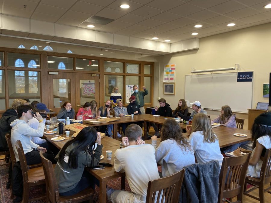SIACs, along with teacher leaders Mr. Menge and Ms. Bowman, meet in the NAR to discuss spirit initiatives and other plans to benefit the Blake community