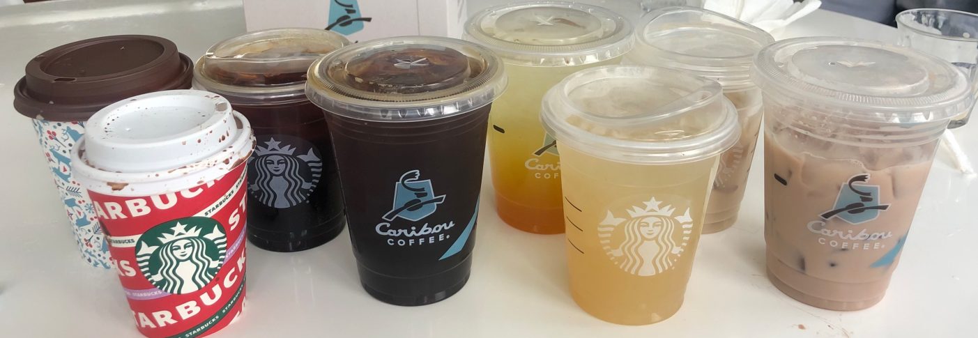 Size small drinks are compared from left to right: hot chocolate, ice black coffee, green tea lemonade, and iced chai latte. 