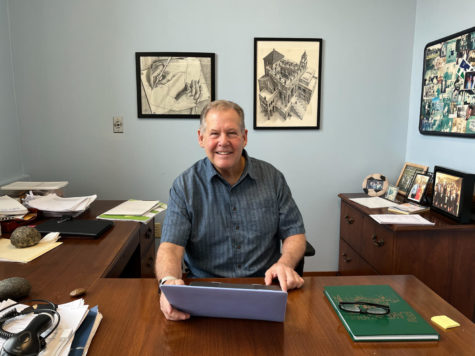 Menge works behind his desk outside the senior lounge. His office is decorated with gifts of gratitude from former students. During his time at Blake he has also been a biology teacher, soccer coach, interim Upper School Director and a grade dean as well as an advisor to a current junior advisory. 