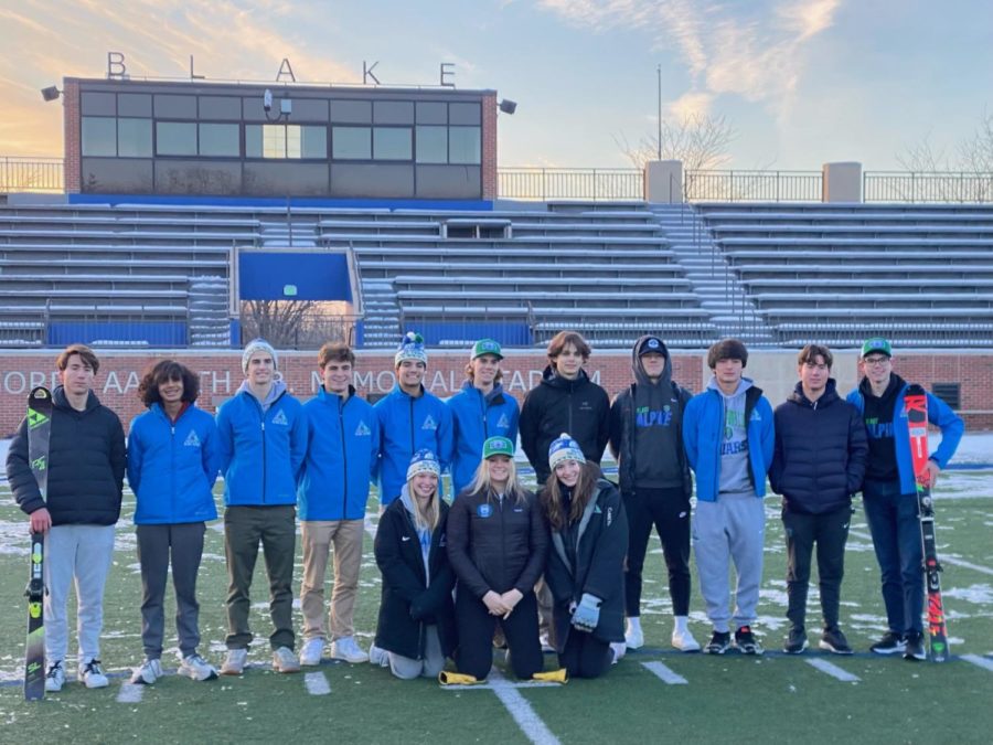 Ski team seniors pose for their team pictures at Aamoth. Back: Phillip Mariano ‘23, Gaurav Haldar ‘23, William Connor ‘23, Oscar Walsh ‘23, AJ Khan ‘23, Tyler Girk ‘23, Alex Chiesa ‘23, Jackson Moon ‘23, Alex Ha ‘23, Carl Mariano ‘23, and Josh Smith ‘23. Front: Edinburgh, Lily Erlandson ‘23, and Kate Rekas ’23