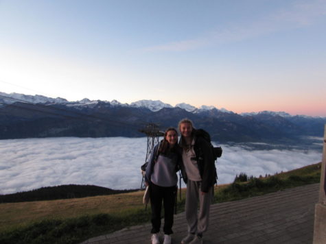 Vivien Pihlstrom and her friend Daisy pose in front of the cloud covered Thunersee Lake at sunset after taking the gondola up. Groups of 10-17 attended the different weekend trips. 