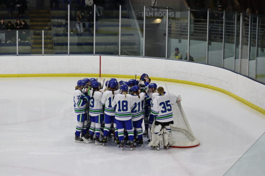 Before+their+section+finals+rematch+against+Edina+at+Parade+Stadium%2C+the+entire+roster+gathers+together+to+in+front+of+the+goal+crease+to+preapre.+The+game+was+the+last+time+that+11+seniors%2C+including+Higuchi%2C+Wethington%2C+and+the+other+three+captains%2C+wore+the+white%2C+blue+and+green.
