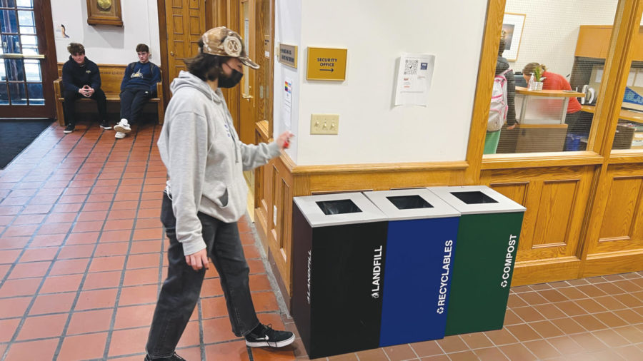 Julia Rasmussen 23 ponders where to put her candy wrapper in the Senior Lounge. This lounge, which is the most frequented in school, has three garbage options, while other places usually only have two. 