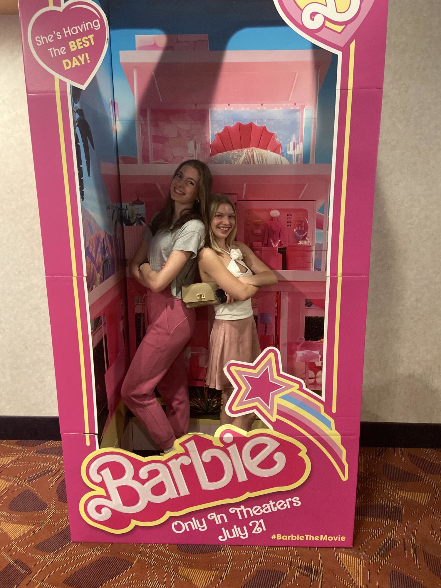 Wearing pink to watch “Barbie” and black to see “Oppenheimer” has become an exciting trend. Kate Rekas ‘23 and Zoe Edinburgh ‘23 posed in a Barbie box dressed in pink.