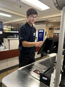 Capistrant checks out a customer. Regarding his job, he states, “I think it’s getting yourself out there, especially when you’re a teenager. It’s good to get some experience working for like college, and future jobs, it’s just nice to
be able to have that past experience.”
