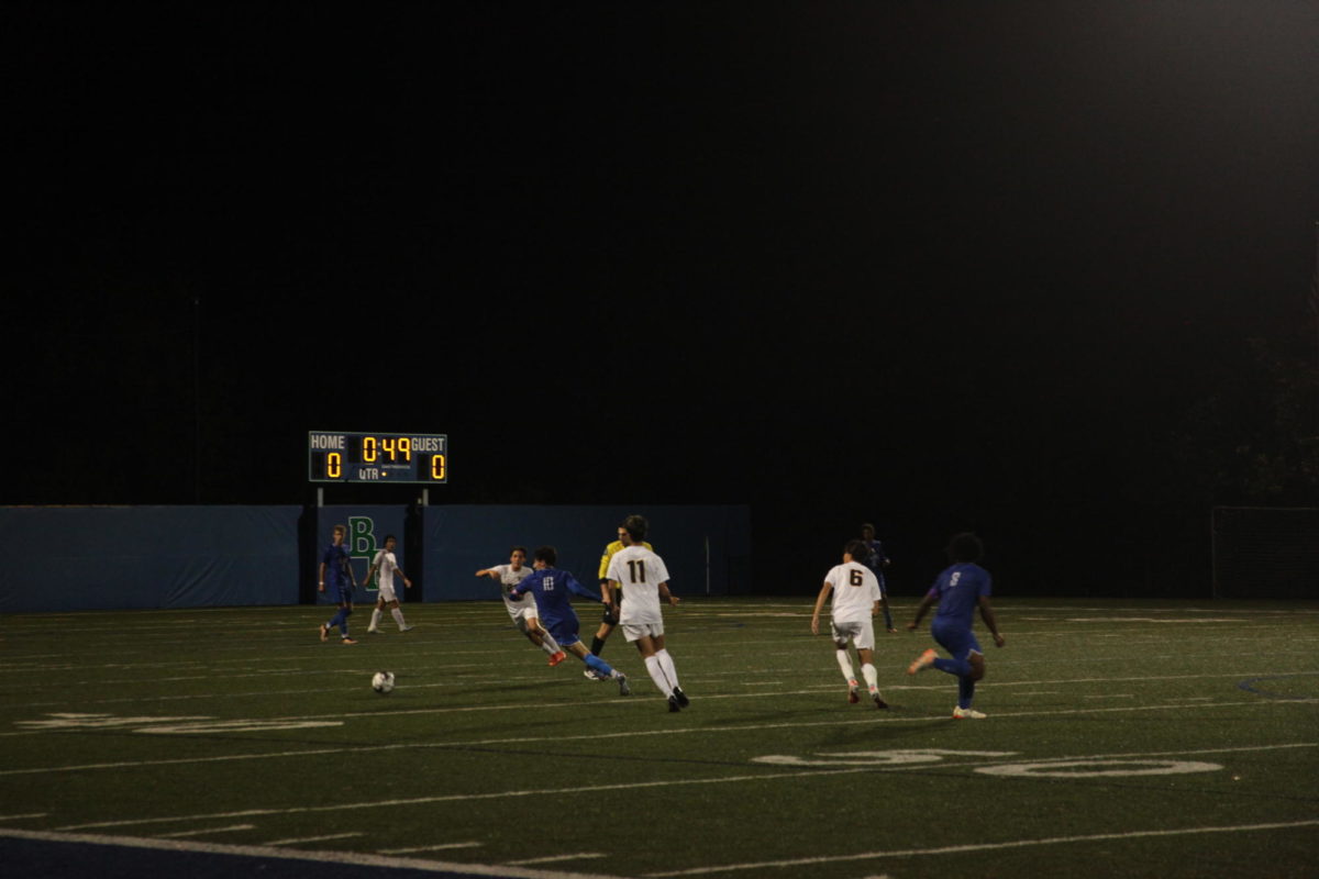 Captain Charlie Silvestri ‘25 uses impressive skill to dribble through Breck’s defenders.