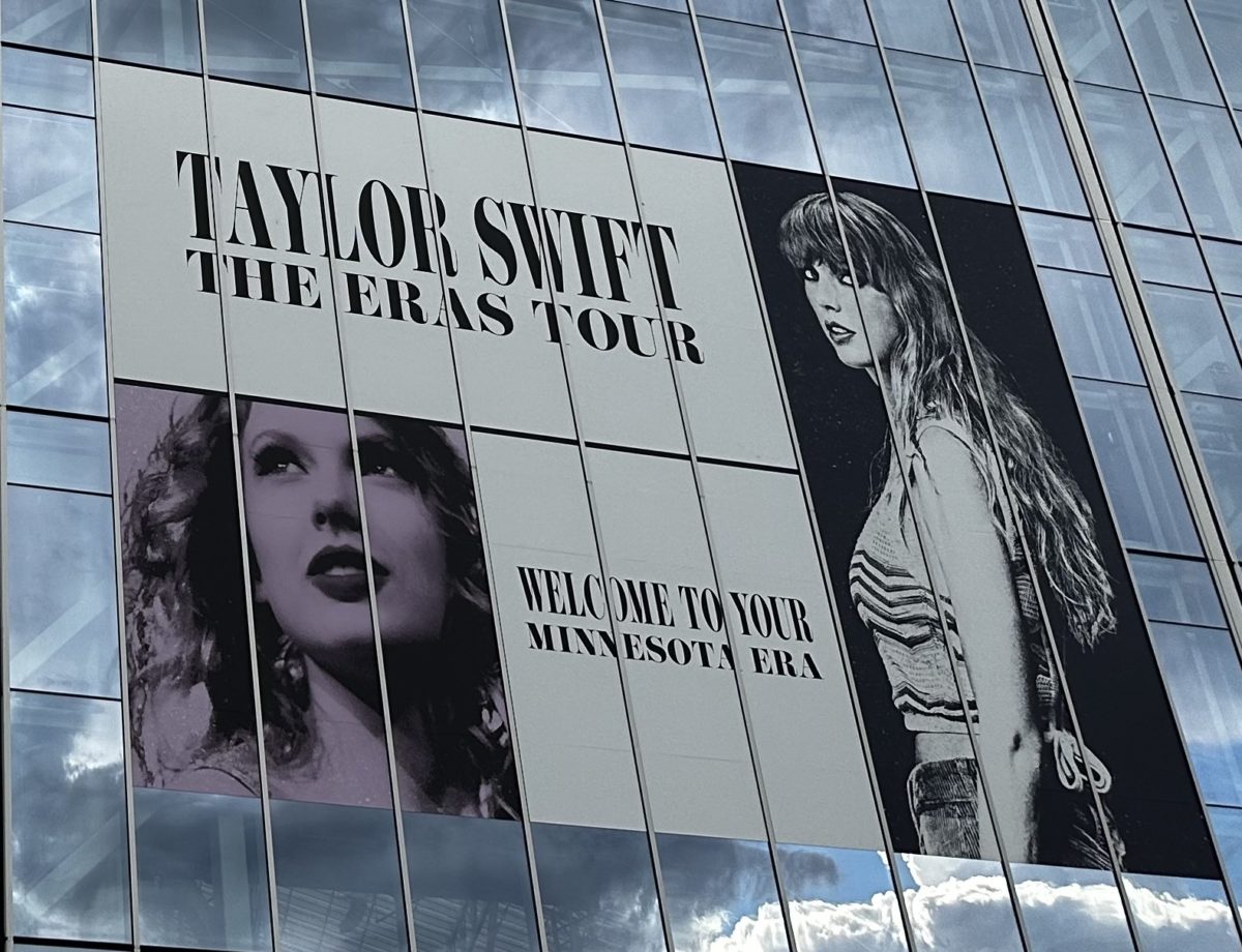 Taylor+Swift%E2%80%99s+Eras+Tour+logo+on+the+outside+of+the+US+Bank+Stadium+downtown+Minneapolis%2C+MN+in+June+from+when+she+performed+there.+
