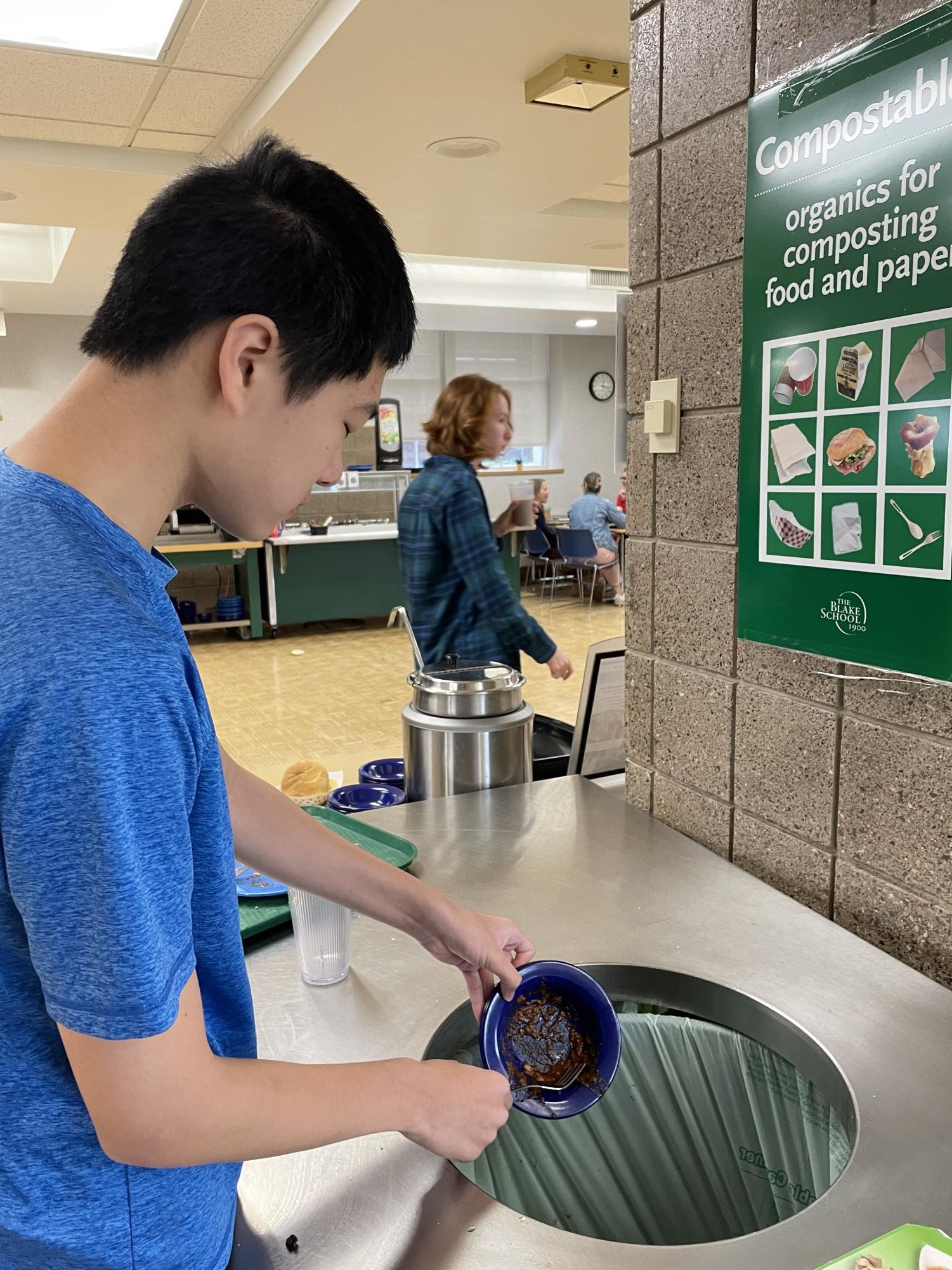 Aidan Zhang 25 throws away his food after lunch on Friday, Oct. 27.