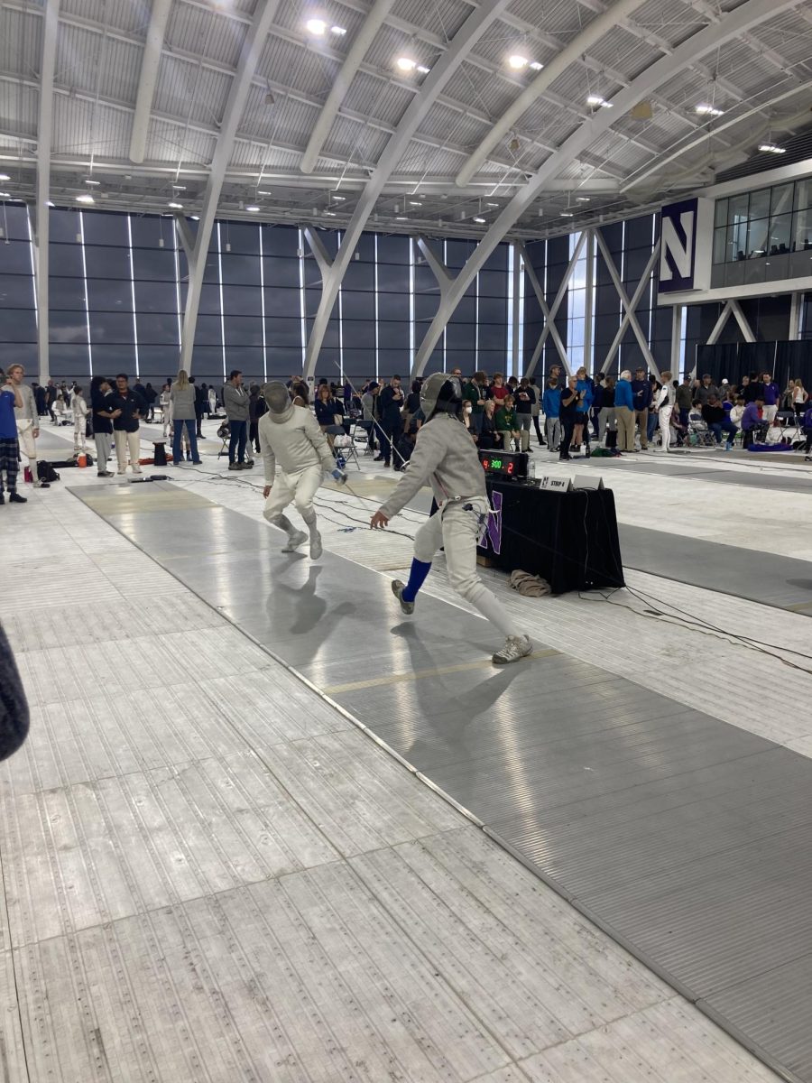 Jeffrey Chen ‘26 (right) fencing an opponent at Northwestern’s Ryan Fieldhouse. Chen placed 31st in Juniors and 20th in Cadets.