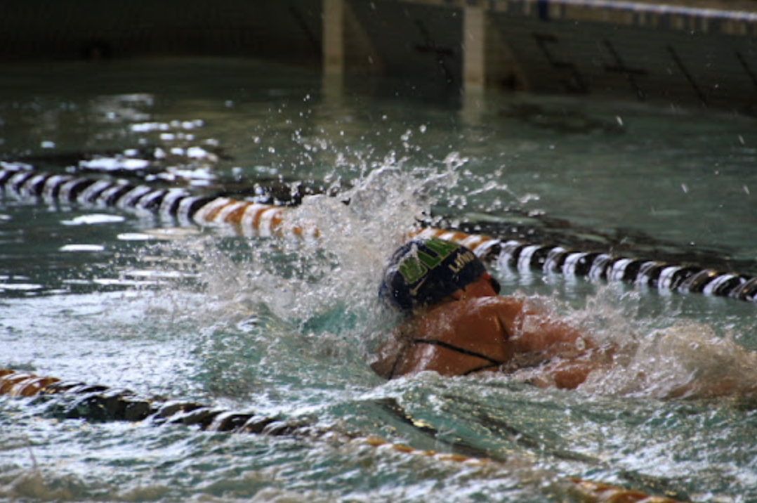 Karin Lund swimming the 500 freestyle during a heated swim meet at Breck.