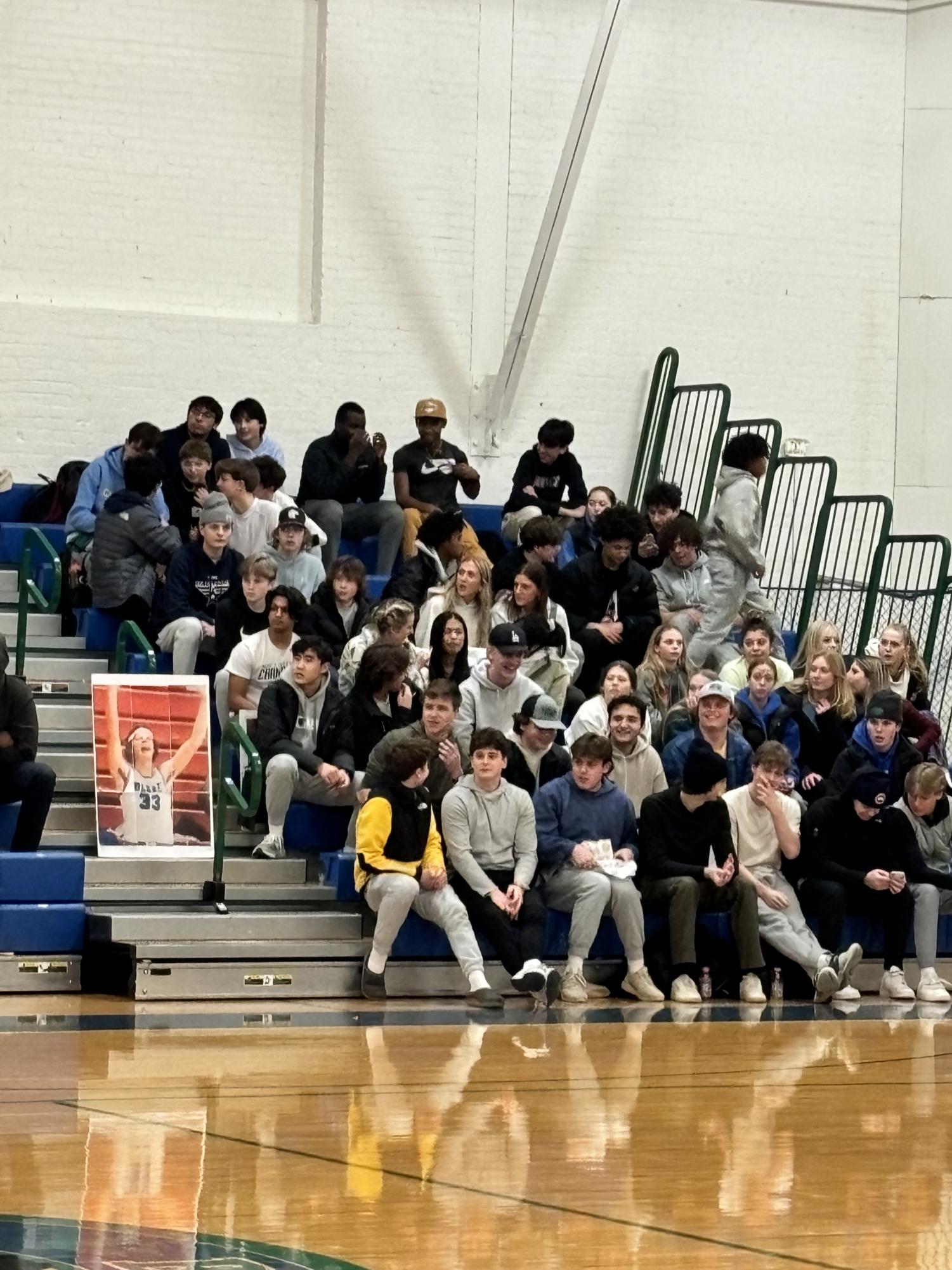 Crowd engages in recent varsity Boys’ Basketball game.
