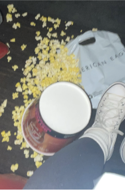 Antonia Pflaum 27s spilled popcorn scattered on the movie theater floor.