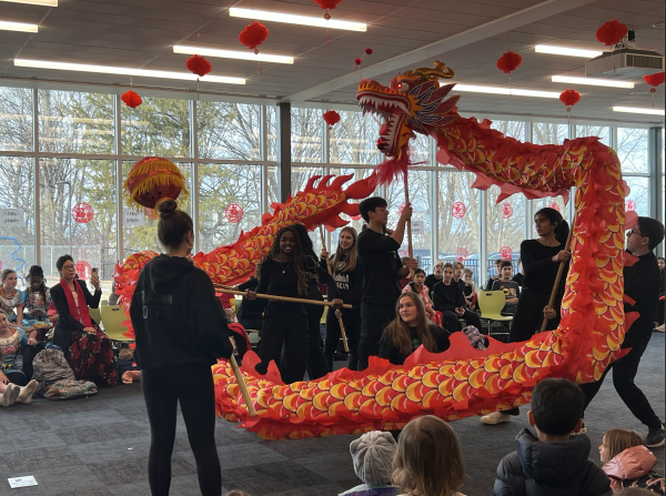 Most of the Chinese IV class, including Rossalyn Moore ‘25, Macaella Sikhoya ‘25, Emma Connor ‘25, Kai Capistrant ‘25, Sophia Peterson ‘25, and Anya Agrawal ‘25 perform their dragon dance with excitement during the Chinese New Year Celebration.