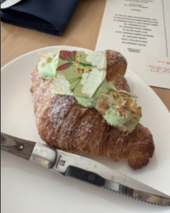 The coconut pandan, a tropical Southeast Asian fruit that has the taste of vanilla, croissant is made of flaky buttery layers filled and topped with coconut pandan custard.