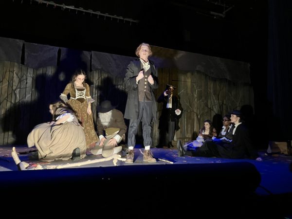 Kyan Norberg '27 delivers monologue during a spooky moment in the play.