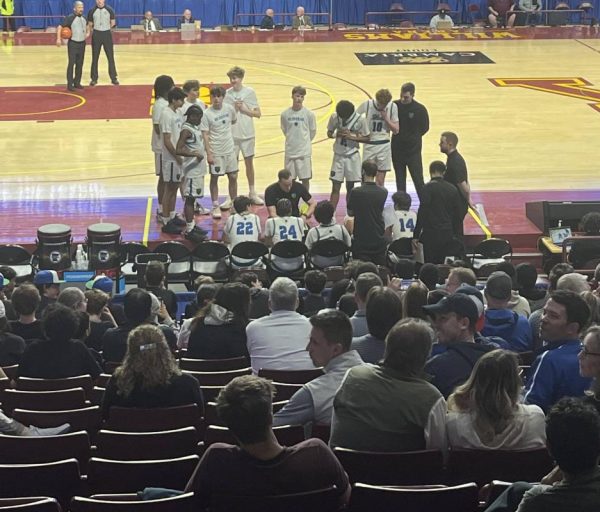 Coach Biwan (center) led the team to an unprecedented state run. The semifinal took place at Williams Arena. During this timeout on March 25, the Bears led Pequot Lake 25-22.