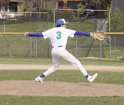 Captain Jesse Posada '26 throws a pitch during the team's final home game, a 4-3 win against Saint Agnes on May 12.