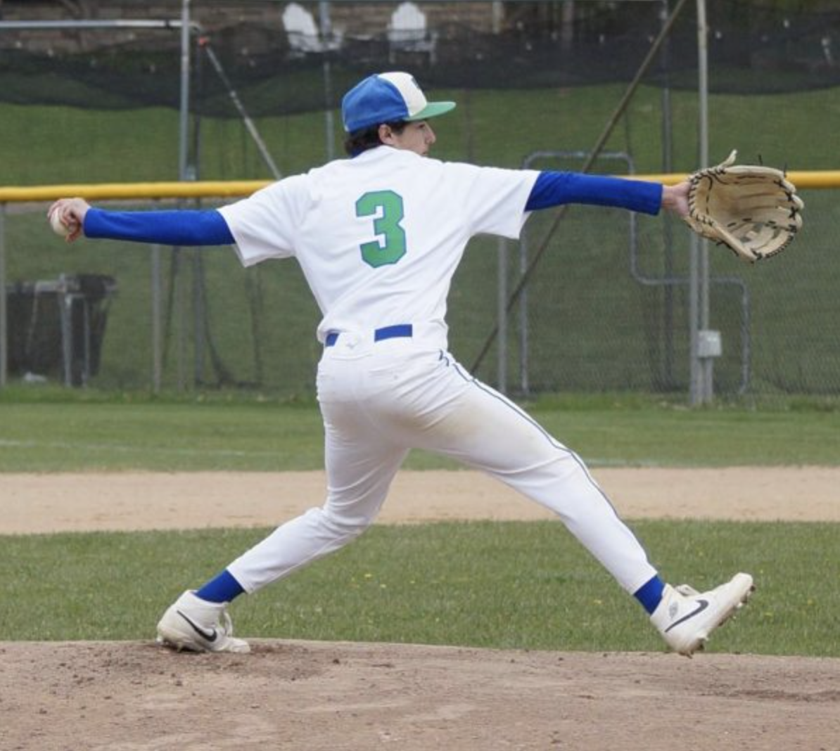 Captain Jesse Posada ‘26 throws a pitch during the team’s final home game, a 4-3 win against Saint Agnes on May 12.