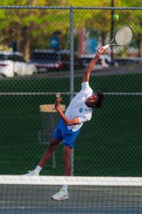 Gopalakrishnan hits a serve during a home match against Mounds Park Academy on May 11.