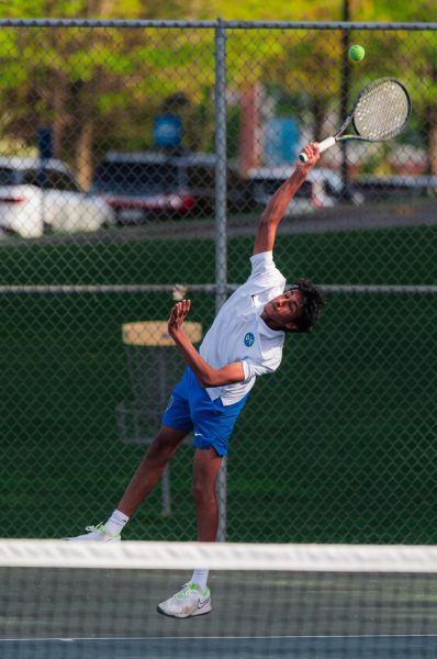 Gopalakrishnan hits a serve during a home match against Mounds Park Academy on May 11. 